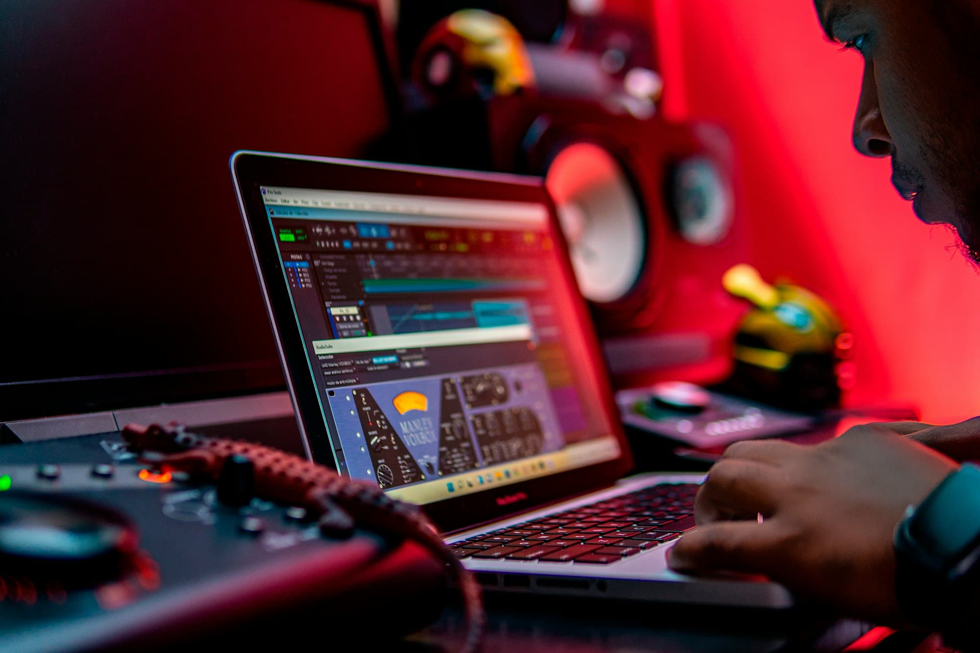 A producer working in Pro Tools on real studio hardware